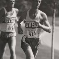 Two Cross Country runners running.